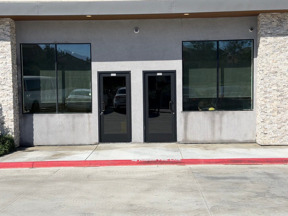 Storefront glass and stucco cleaned at a commercial property