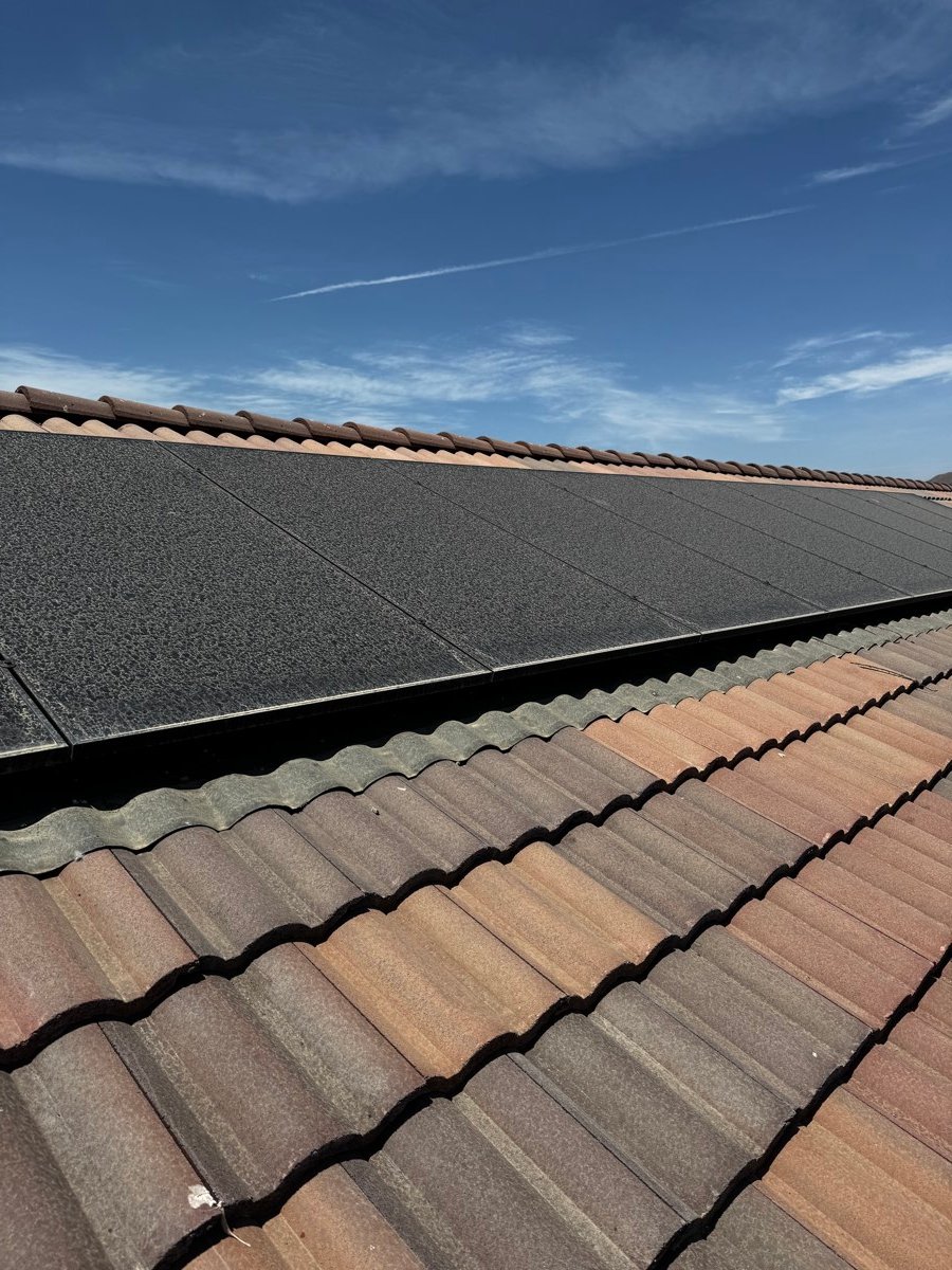 Close-up of a clay tile roofline cleaned of algae and debris